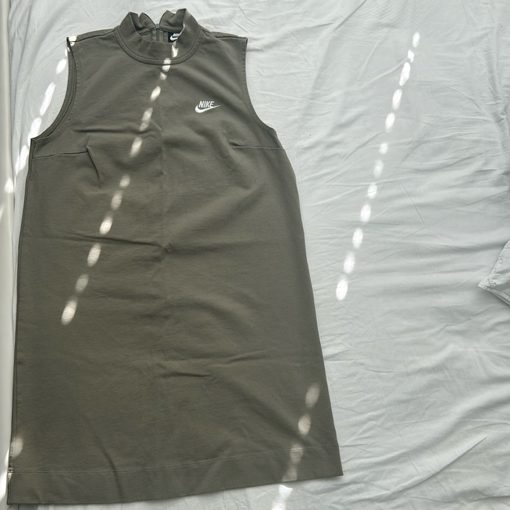 This is an olive green Nike high-neck dress.